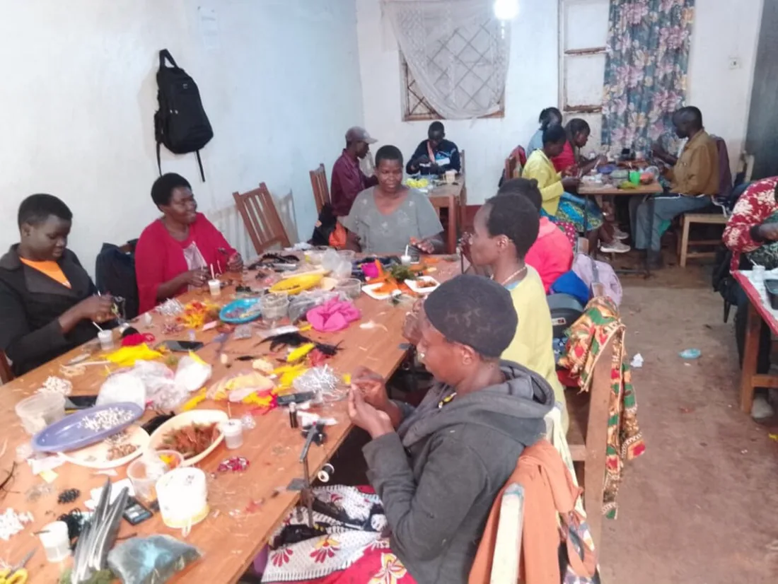 Trained tiers hand-tying fishing flies at the Wholesale Fishing Flies Kenya workshop